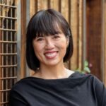 Life and Dating Coach Caroline Millet smiling and wearing a black top.
,